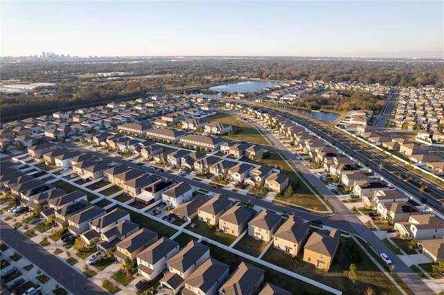 birds eye view of property featuring a residential view and a water view