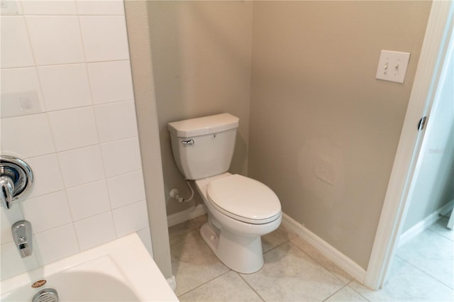 full bathroom featuring baseboards, a shower, toilet, and tile patterned floors