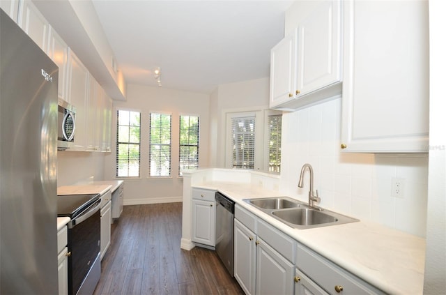 kitchen featuring white cabinetry, stainless steel appliances, and light countertops