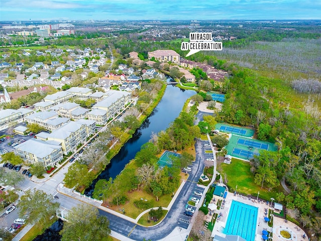 birds eye view of property with a water view