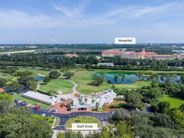 birds eye view of property featuring a water view and golf course view