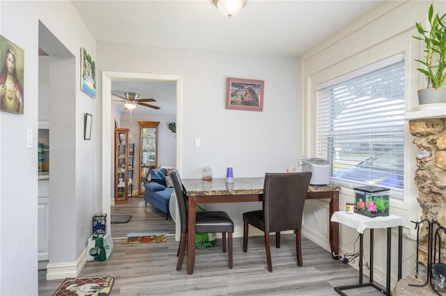 1006 San Domingo Rd, Orlando, FL 32808 - dining space featuring ceiling fan, baseboards, and light wood-style floors