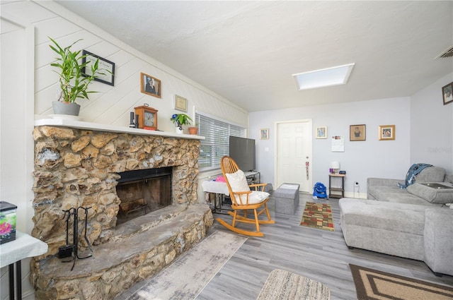 1006 San Domingo Rd, Orlando, FL 32808 - living area with light wood-type flooring, a fireplace, and visible vents