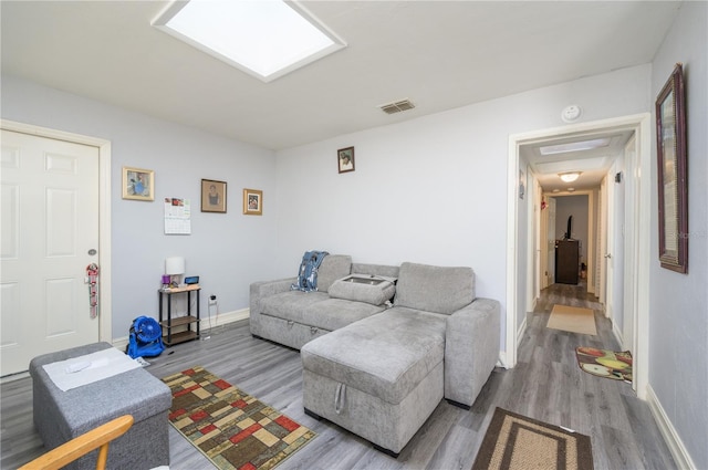 1006 San Domingo Rd, Orlando, FL 32808 - living room featuring baseboards, visible vents, and wood finished floors