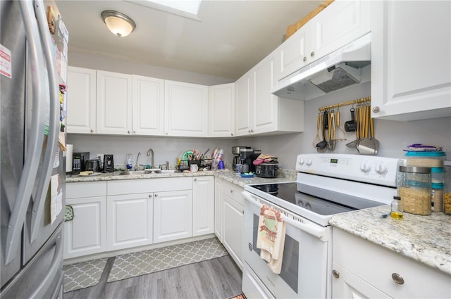 1006 San Domingo Rd, Orlando, FL 32808 - kitchen featuring white range with electric stovetop, white cabinets, freestanding refrigerator, under cabinet range hood, and a sink