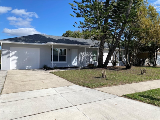 ranch-style house with driveway, stucco siding, a garage, and a front yard