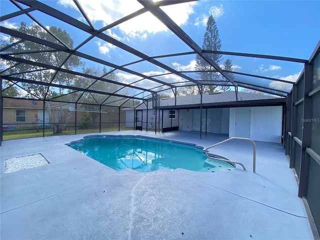 pool with a lanai and a patio