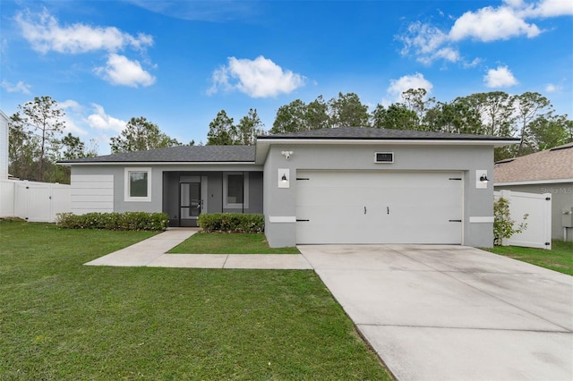 view of front of house with a gate, driveway, an attached garage, stucco siding, and a front lawn