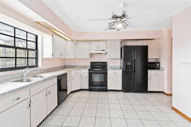 kitchen featuring black appliances, light countertops, white cabinets, and under cabinet range hood