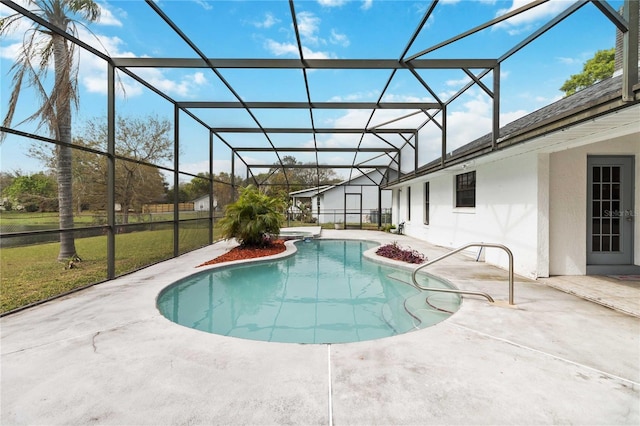 outdoor pool featuring a lanai and a patio