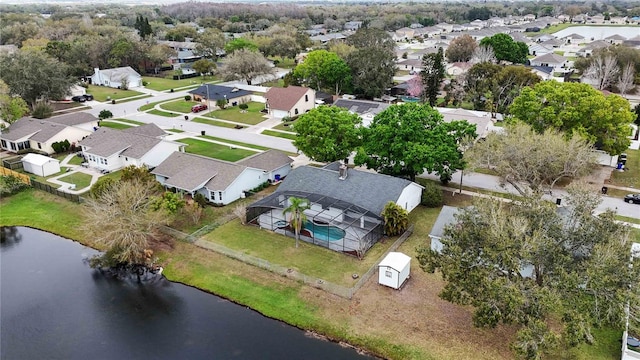 drone / aerial view with a residential view and a water view