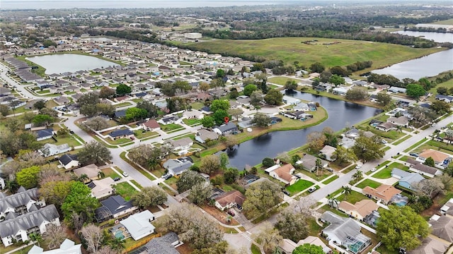 birds eye view of property featuring a residential view and a water view