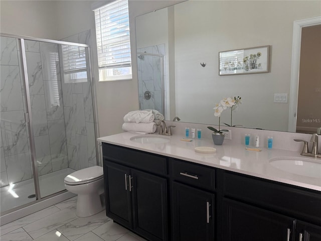 full bathroom with marble finish floor, double vanity, a sink, and a marble finish shower