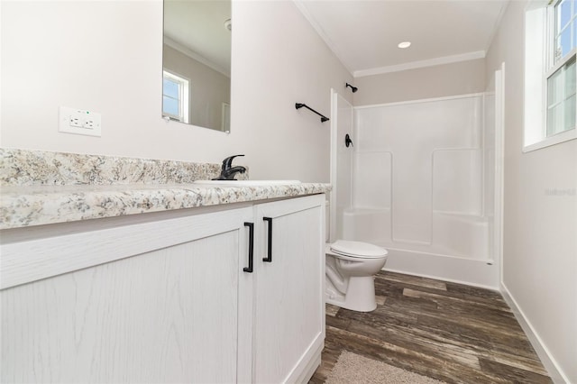 bathroom featuring toilet, wood finished floors, vanity, a shower, and crown molding