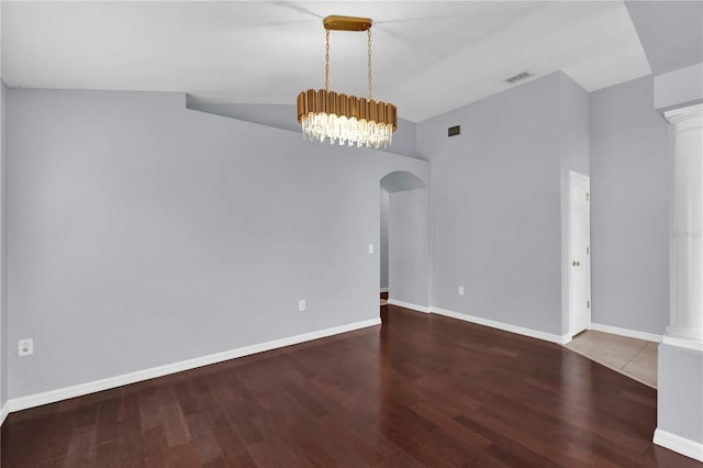923 Tramells Trl, Kissimmee, FL 34744 - empty room with baseboards, arched walkways, and wood finished floors