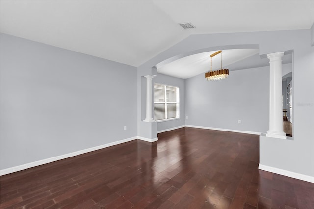 923 Tramells Trl, Kissimmee, FL 34744 - unfurnished room featuring baseboards, visible vents, lofted ceiling, dark wood-style flooring, and ornate columns