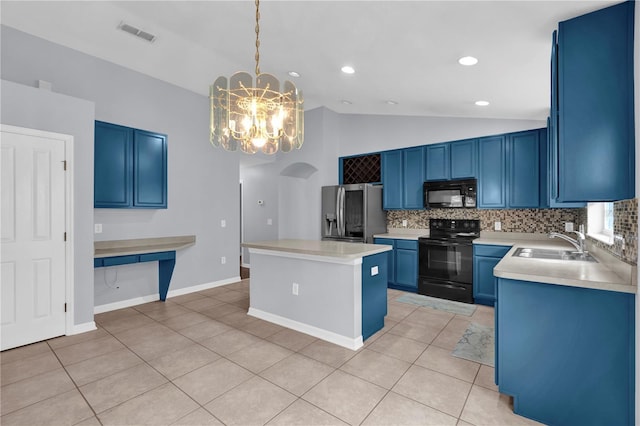 923 Tramells Trl, Kissimmee, FL 34744 - kitchen with light countertops, a sink, decorative light fixtures, and black appliances