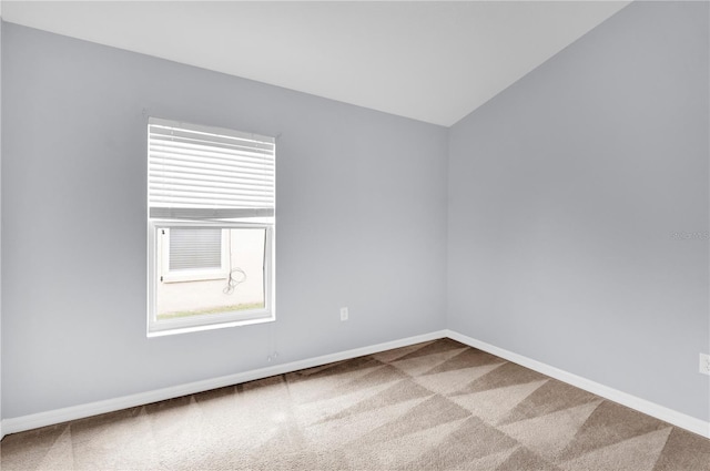 923 Tramells Trl, Kissimmee, FL 34744 - carpeted empty room with baseboards and vaulted ceiling