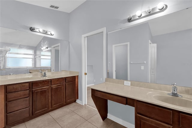 923 Tramells Trl, Kissimmee, FL 34744 - full bath with two vanities, tile patterned flooring, a sink, and visible vents