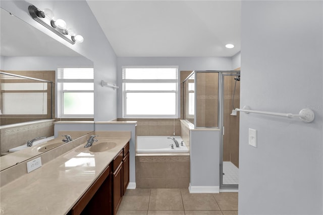923 Tramells Trl, Kissimmee, FL 34744 - full bathroom with a wealth of natural light, tile patterned flooring, a shower stall, and a bath