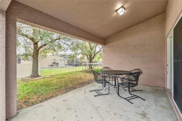 923 Tramells Trl, Kissimmee, FL 34744 - view of patio / terrace with fence and outdoor dining area