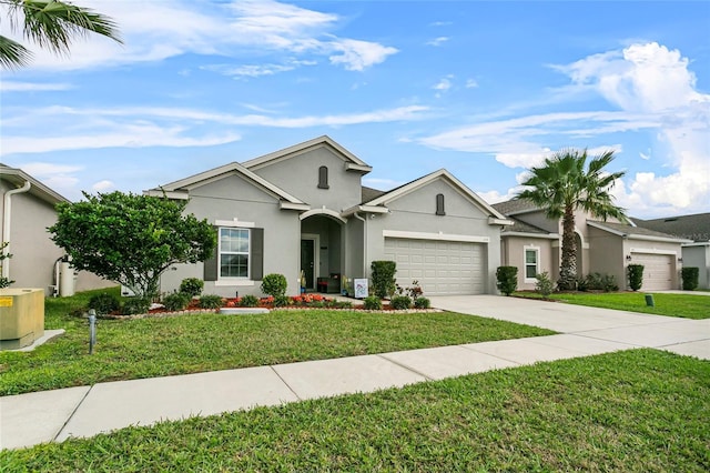 single story home with a front yard, concrete driveway, an attached garage, and stucco siding