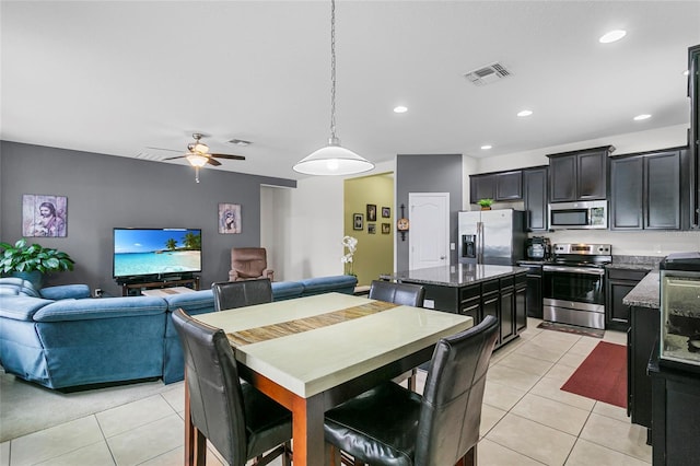 dining area featuring light tile patterned floors, a ceiling fan, visible vents, and recessed lighting