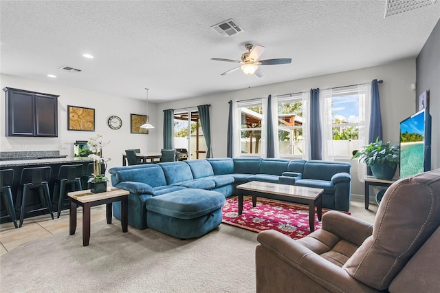 living room with light carpet, visible vents, a ceiling fan, and recessed lighting