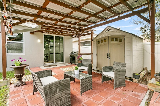 view of patio featuring an outbuilding, area for grilling, a pergola, fence, and a shed