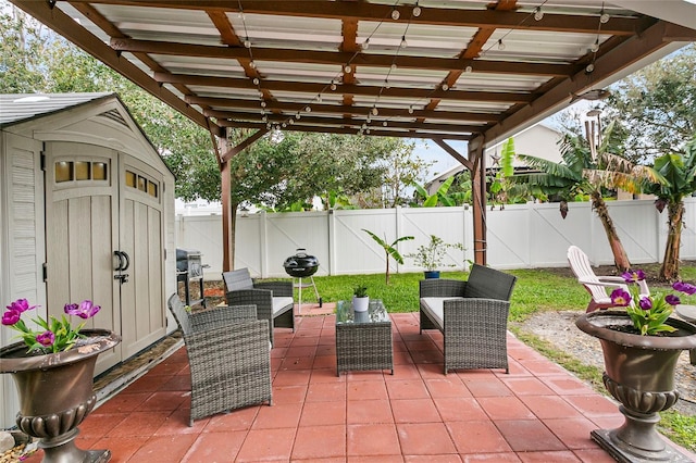 view of patio / terrace with a fenced backyard, a storage shed, and an outdoor hangout area