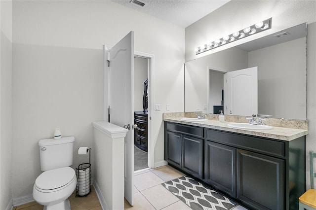 full bathroom featuring tile patterned flooring, visible vents, a sink, and double vanity