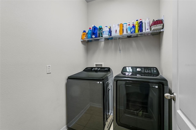 laundry room with laundry area and washing machine and clothes dryer