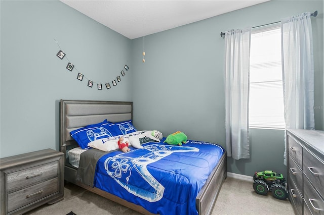 bedroom featuring baseboards