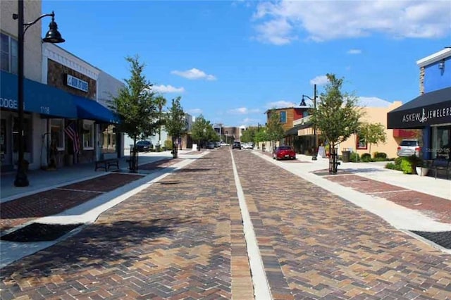 view of road with curbs and sidewalks