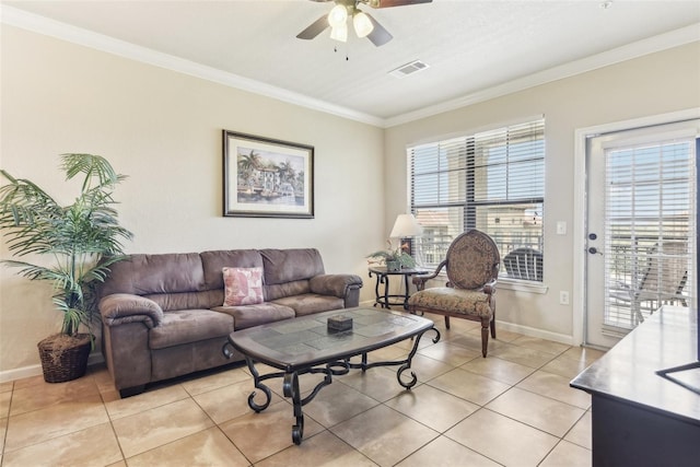 living area with visible vents, ornamental molding, a ceiling fan, light tile patterned flooring, and baseboards