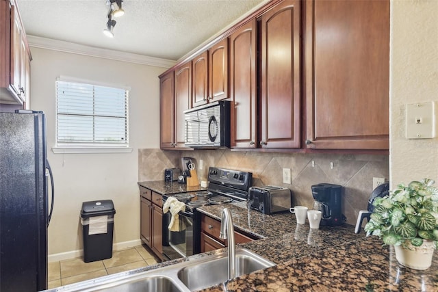 kitchen featuring black appliances, a textured ceiling, ornamental molding, and dark stone countertops