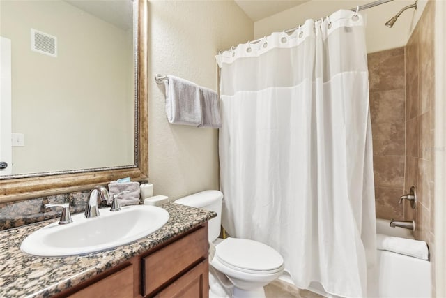 full bathroom with visible vents, shower / tub combo with curtain, vanity, and toilet