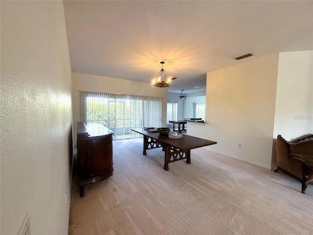 318 Rock Springs Dr, Poinciana, FL 34759 - dining space featuring light colored carpet, plenty of natural light, a chandelier, and baseboards