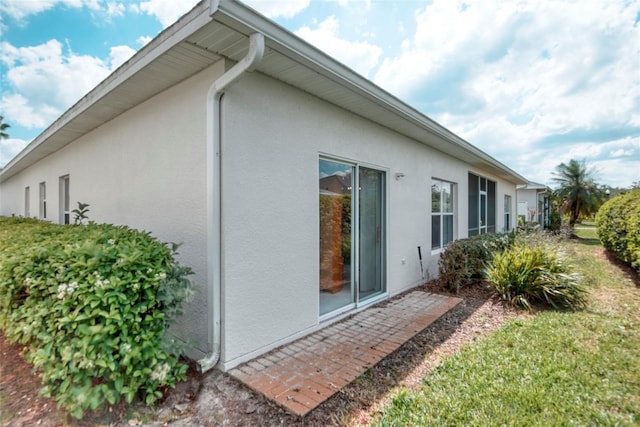 318 Rock Springs Dr, Poinciana, FL 34759 - view of home's exterior with stucco siding
