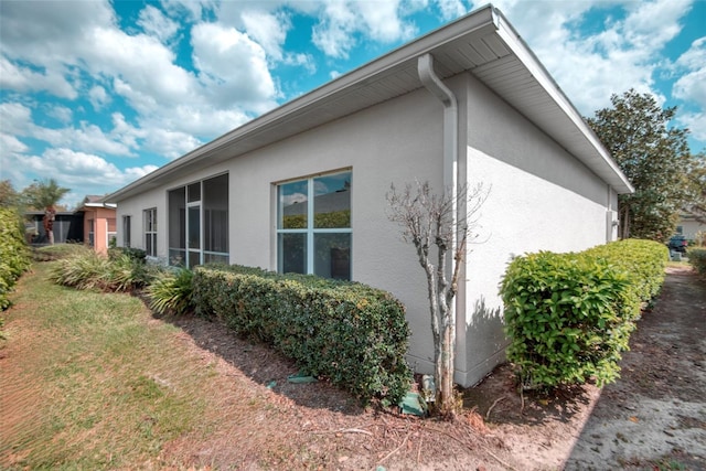 318 Rock Springs Dr, Poinciana, FL 34759 - view of side of property featuring stucco siding