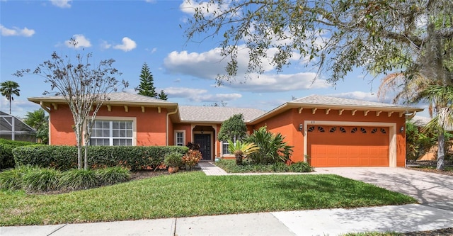 ranch-style house with glass enclosure, a garage, driveway, stucco siding, and a front lawn