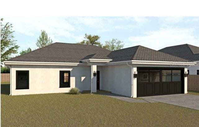 view of front of property with stucco siding, fence, concrete driveway, a front yard, and an attached garage