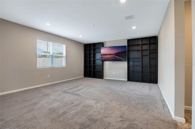 carpeted empty room with recessed lighting, visible vents, and baseboards