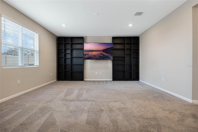 unfurnished room featuring light carpet, recessed lighting, visible vents, and baseboards