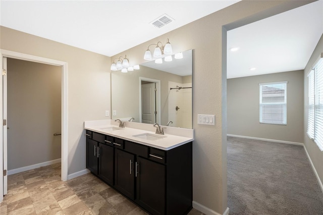 full bath featuring baseboards, visible vents, and a sink