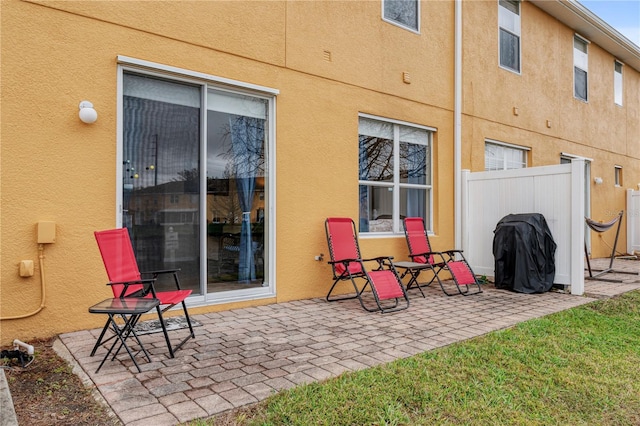 view of patio / terrace featuring fence