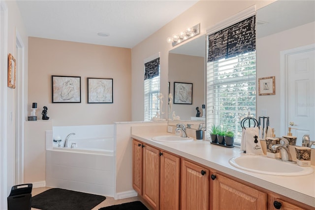 full bath with double vanity, a garden tub, and a sink