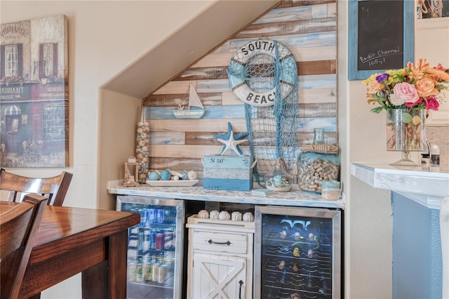 bar featuring a bar and beverage cooler