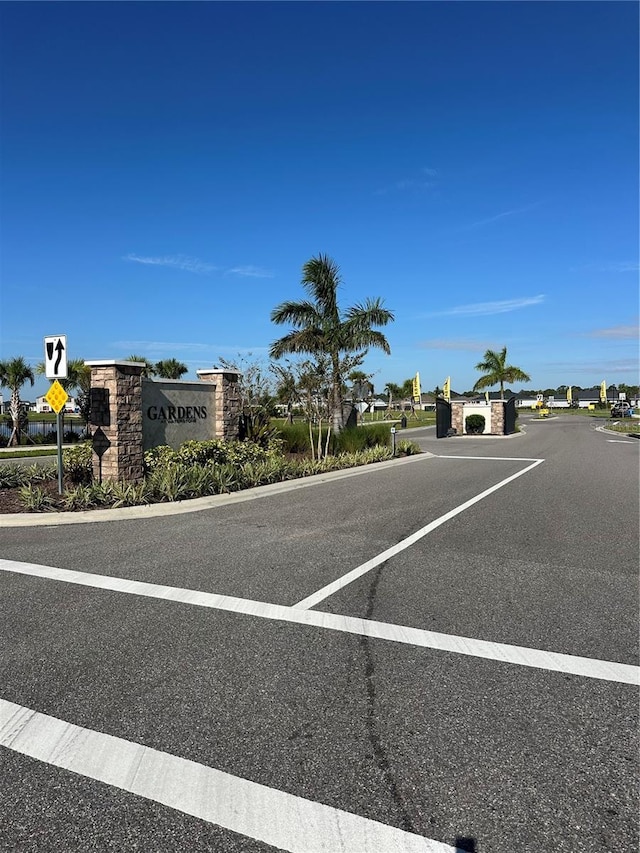 view of street with curbs and traffic signs