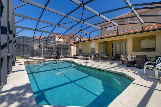 113 Tiger Lily Ct, Davenport, FL 33837 - view of swimming pool featuring a patio, a pool with connected hot tub, and glass enclosure